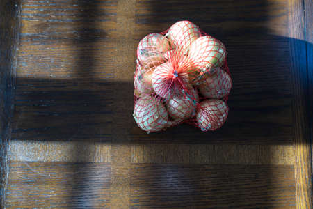 Yellow Onions on Brown  Tableの写真素材