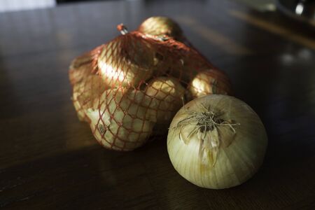 Yellow Onions on Brown  Tableの写真素材