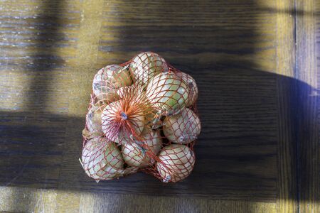 Yellow Onions on Brown  Tableの写真素材