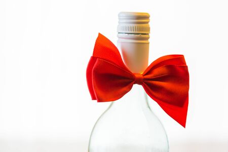 Bottle with red bow tie - Gift for Christmasの写真素材