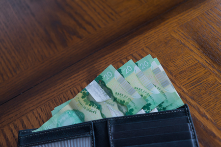 black leather wallet with Canadian Dollar notesの写真素材