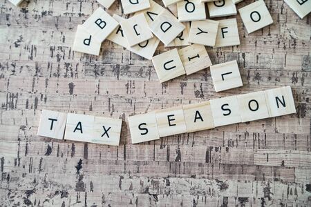 Tax Season spelled out in Letter tilesの写真素材