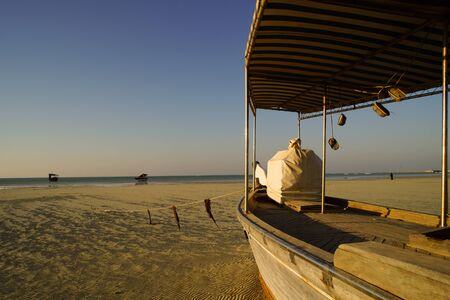 Dhows on beach in Qatar with peaceful seaの写真素材