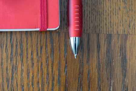 Red Note with Red Pen Macro Shot from Aboveの写真素材