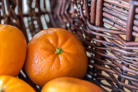 Orange Mandarin in rustic Basketの写真素材