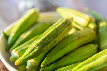 Bowl of Okra in White bowl in sunlight