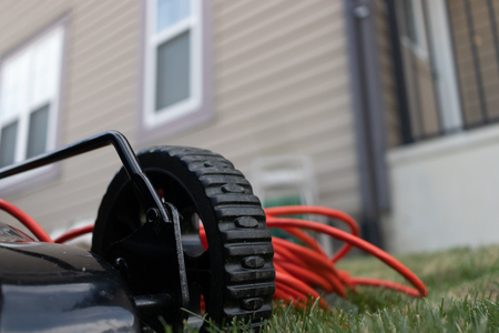 Electric Lawnmower with cable in Gardenの写真素材