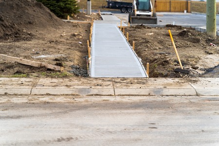 Newly laid footpath on construction siteの写真素材