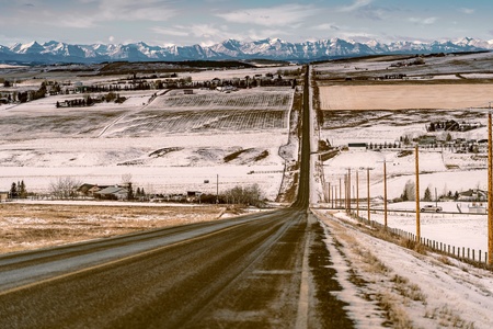 Rural road running through a farm landscape