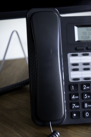 Office Telephone console on wood table