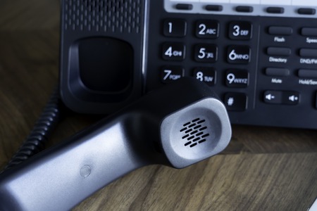 Office Telephone console on wood table
