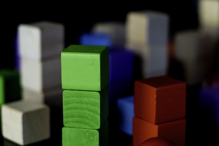 Toy wood blocks for Children to play with on black backgroundの写真素材