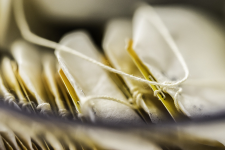 Pile of teabags in a box on tableの写真素材