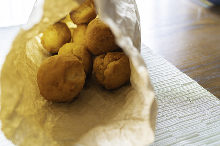 Nigerian Deep Fried buns in a bowl and Paper bagの写真素材