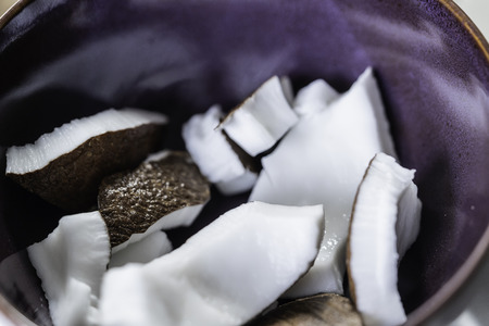 peices of coconut in bowl ready to eatの写真素材