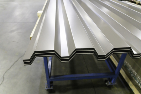 Corrugated galvanised metal roofing sheets on factory workshopの写真素材
