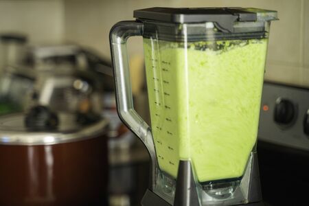 Green Bell Peppers blended to prepare Spicy Nigerian Ofada Stewの写真素材