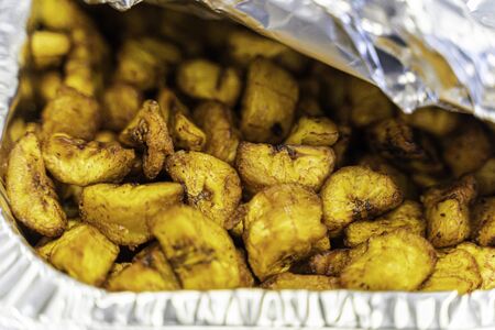 Diced Nigerian Plantain in Aluminum container served at Nigerian Partyの写真素材