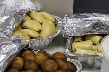 Nigerian finger snacks - Meat Pie, Puff Puff and Sausage Rollの写真素材