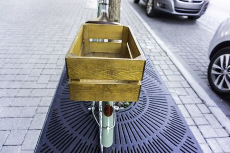 Bicycle with wood crate box on back in city streetの写真素材