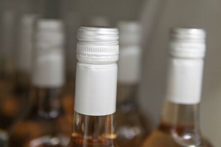 Wine bottles kept cold in a fridge