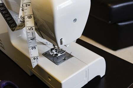 Sewing machine needle with measuring tape