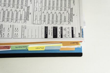 File Binders with Documents to prepare canadian Tax Returnsの写真素材