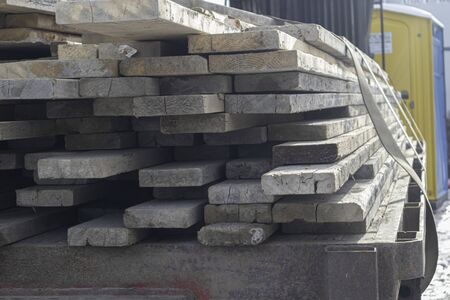 Pile of Wood on trailer bed to be used for contruction siteの写真素材