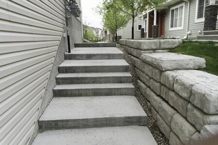 Walway in Apartment block with small retaining wall on right side