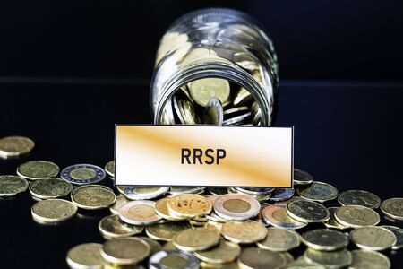 Bottle of coins with RRSP sign - Retirement and savings conceptの写真素材