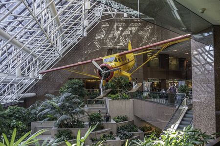 July 6 2018 - Calgary, Alberta Canada - Airplane hanging in interior of suncor tower