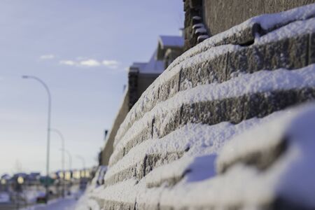 Retaining wall covered with layers of Snow in Winter