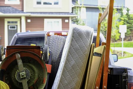 Trash items loaded on a truck to be disposed of at a landfillの写真素材