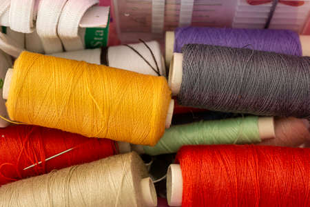 Collection of various colored tread used to sew clothes by a seamstress