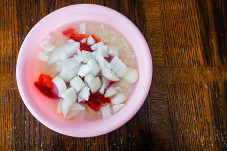 Washed black eyed beans with Peppers and onions to prepare Akara or Moi Moiの写真素材