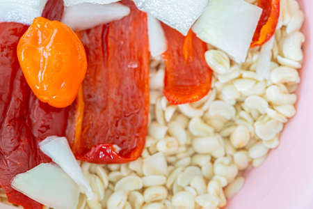 Washed black eyed beans with Peppers and onions to prepare Akara or Moi Moiの写真素材