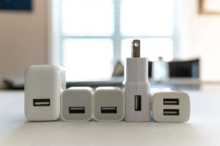 plugs to help charge portable electronics like phones and tabletsの写真素材