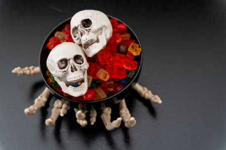 Skeleton Claw hands with Candy and Hand Sanitizer - Halloween Concept