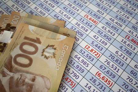 Canadian Dollar notes on a Spreadsheet reportの写真素材
