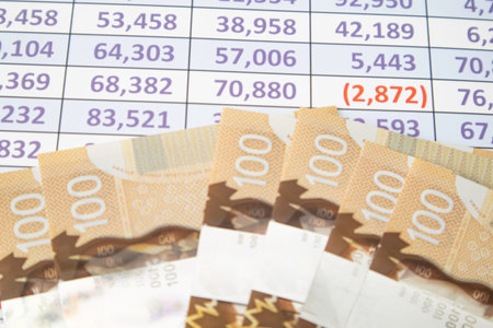 Canadian Dollar notes on a Spreadsheet reportの写真素材
