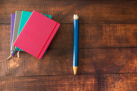 Collection of Colorful Notebooks journasl with large wood pencilの写真素材