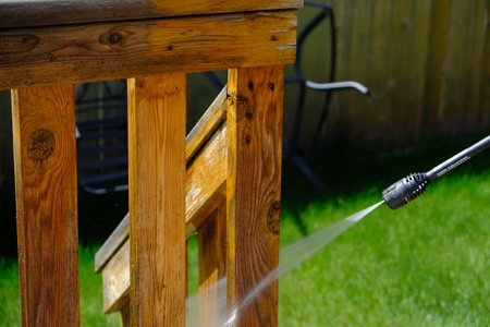 Cleaning House Deck in summer with pressure hoseの写真素材