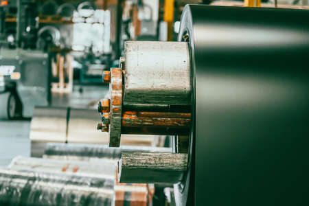 Metal coil on machine in metal roofing factoryの写真素材
