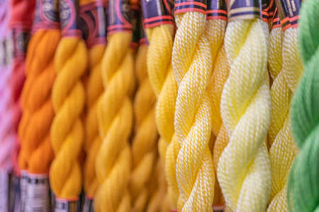 colorful woolen yarns on display at craft shop