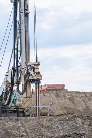 Construction Site - Heavy industrial drilling machine at road worksの写真素材