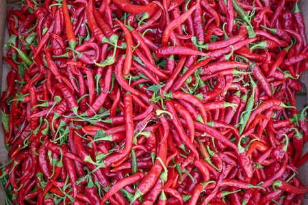 fresh organic Skinny Peppers on display at a farmers market