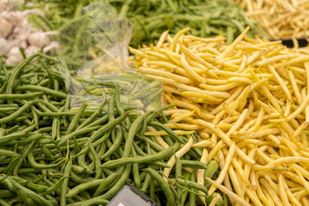 fresh organic Green and Yellow beans on display at a farmers marketの写真素材