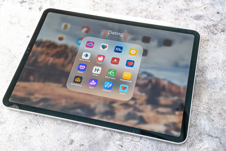 30 October 2021 - Calgary Alberta Canada - Dating apps on an apple Ipad proのeditorial素材