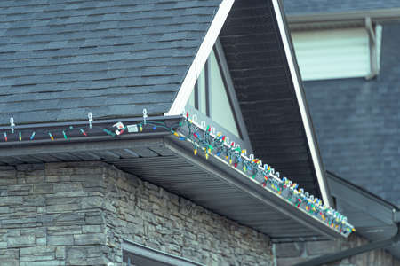 Christmas light on a residential house roofの写真素材