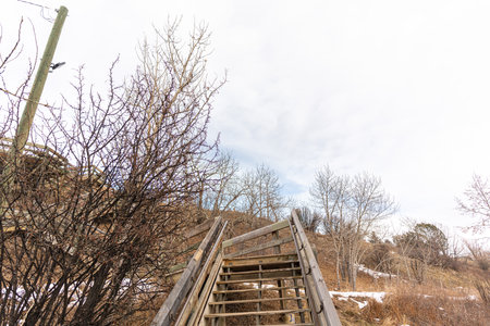 old Wooden staircase walkway in city with railing